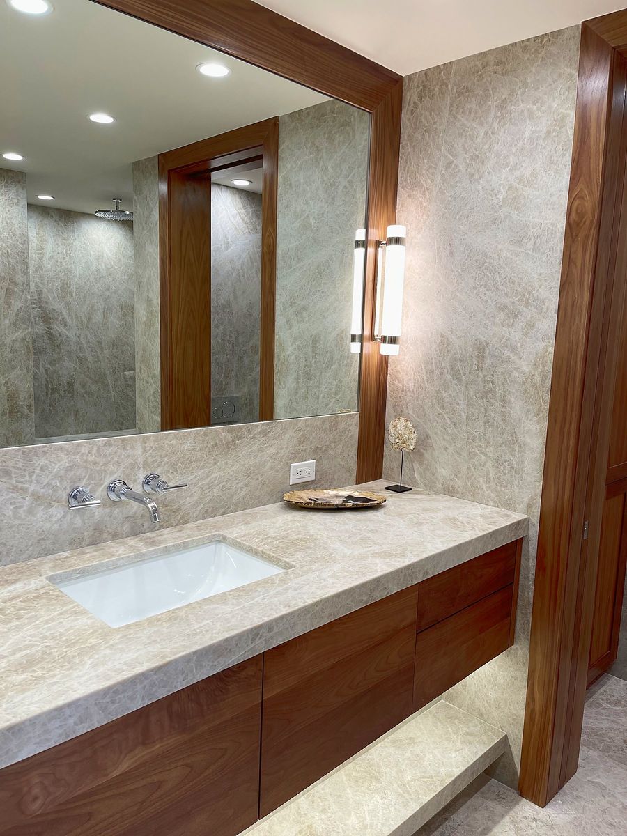 Renovated stone and walnut bathroom