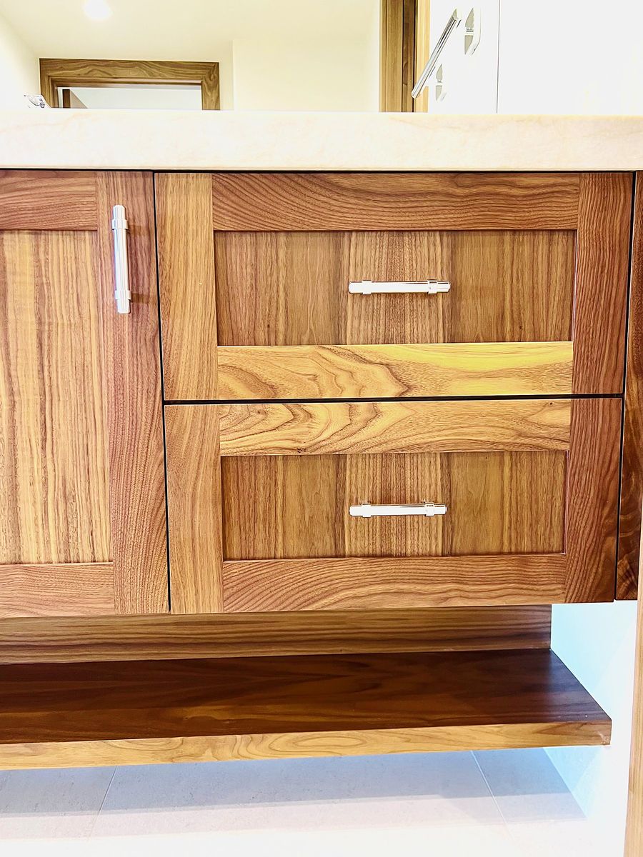 Walnut vanity drawers with floating shelf